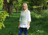 women in crocheted tabard top